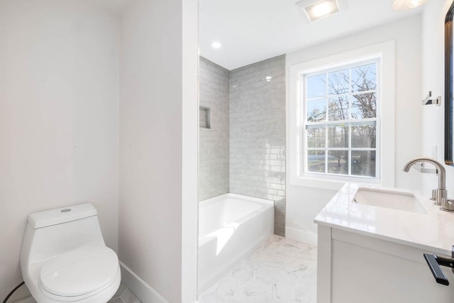 bathroom featuring toilet and vanity