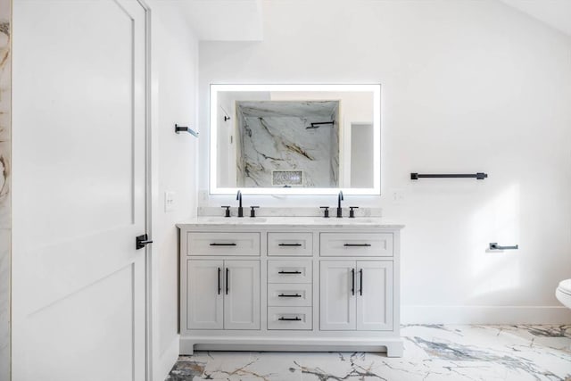 bathroom featuring a shower and vanity