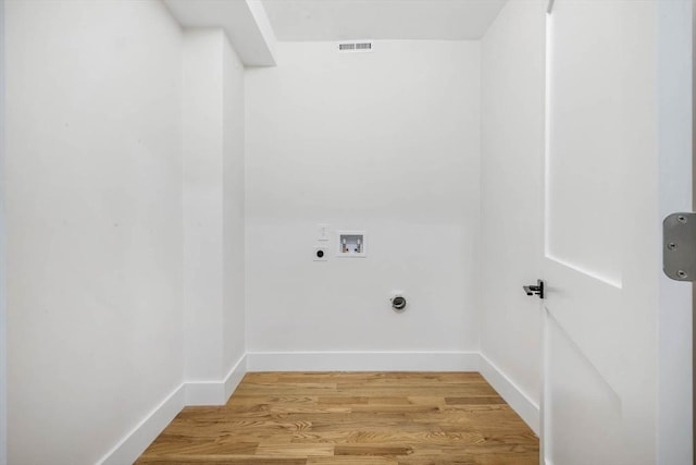 washroom featuring washer hookup, hardwood / wood-style floors, and electric dryer hookup