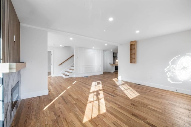 unfurnished living room featuring hardwood / wood-style floors