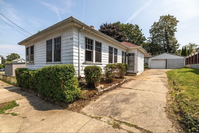 view of home's exterior with an outbuilding and a garage