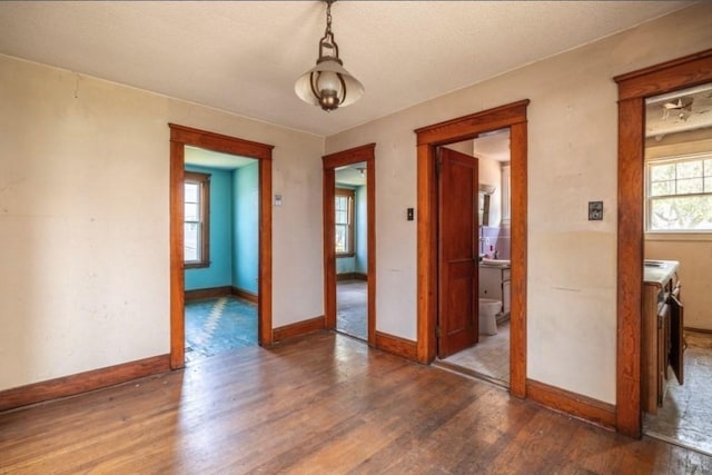 spare room featuring dark wood-type flooring