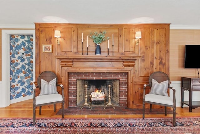114 Chestnut St, North Reading, MA 01864 - living room with a brick fireplace, baseboards, wood finished floors, crown molding, and wallpapered walls