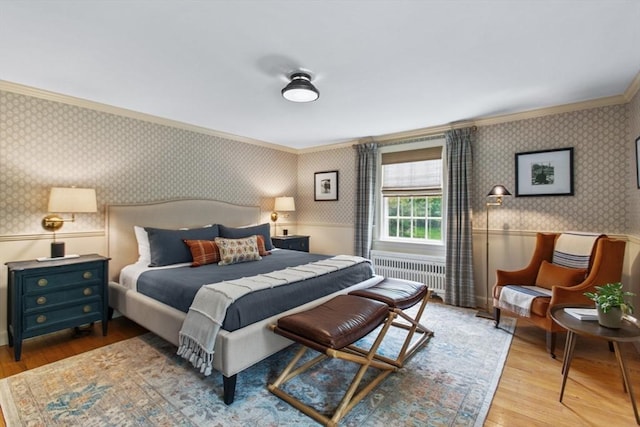 114 Chestnut St, North Reading, MA 01864 - bedroom with wallpapered walls, radiator, crown molding, a wainscoted wall, and wood finished floors