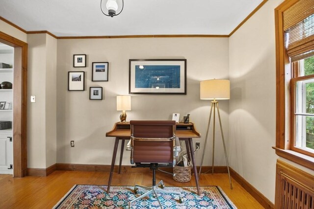 114 Chestnut St, North Reading, MA 01864 - office space featuring wood finished floors, ornamental molding, baseboards, and radiator heating unit