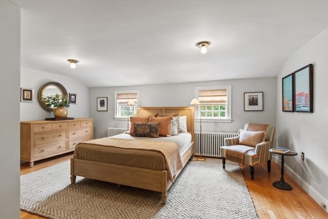 114 Chestnut St, North Reading, MA 01864 - bedroom with radiator, lofted ceiling, wood finished floors, and baseboards