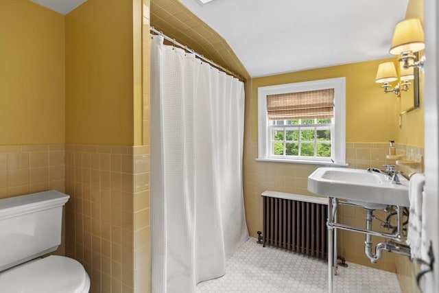 114 Chestnut St, North Reading, MA 01864 - full bath featuring tile walls, radiator, toilet, a shower with shower curtain, and tile patterned floors