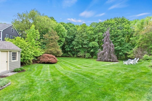 114 Chestnut St, North Reading, MA 01864 - view of grassy yard featuring an outdoor structure