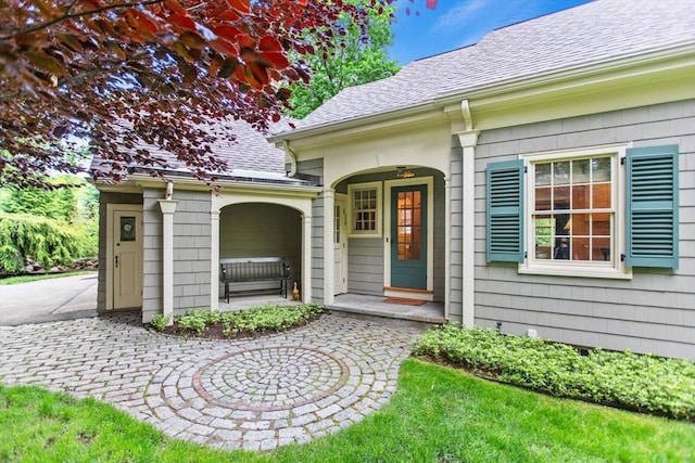 114 Chestnut St, North Reading, MA 01864 - property entrance featuring a shingled roof and a porch