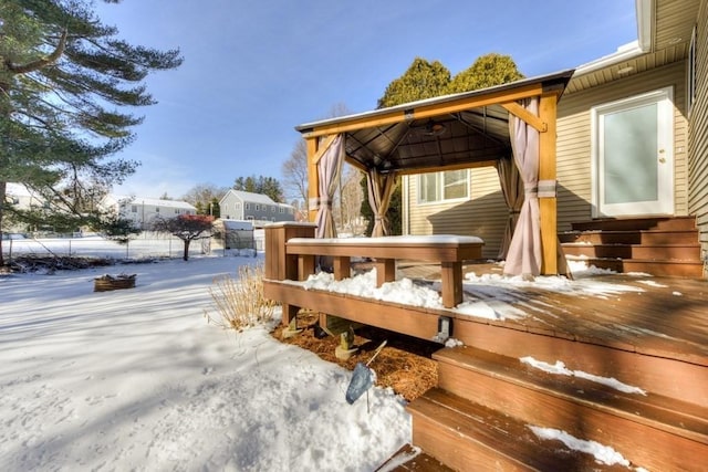 snow covered deck with a gazebo