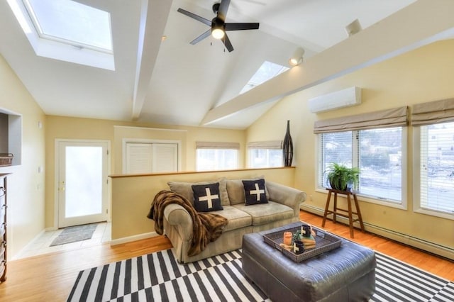 living room with light hardwood / wood-style flooring, ceiling fan, a baseboard heating unit, a wall unit AC, and vaulted ceiling with skylight