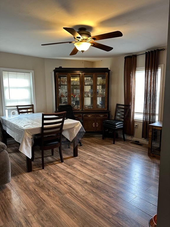 dining room featuring dark hardwood / wood-style floors and ceiling fan