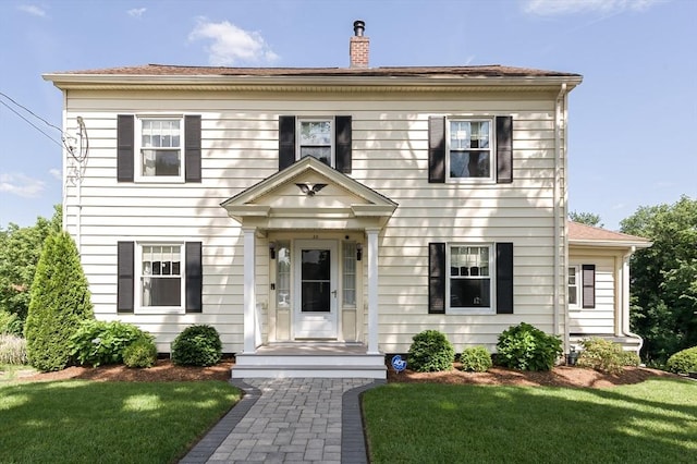 20 Blaine Ave, Worcester, MA 01603 - colonial home featuring a chimney and a front lawn