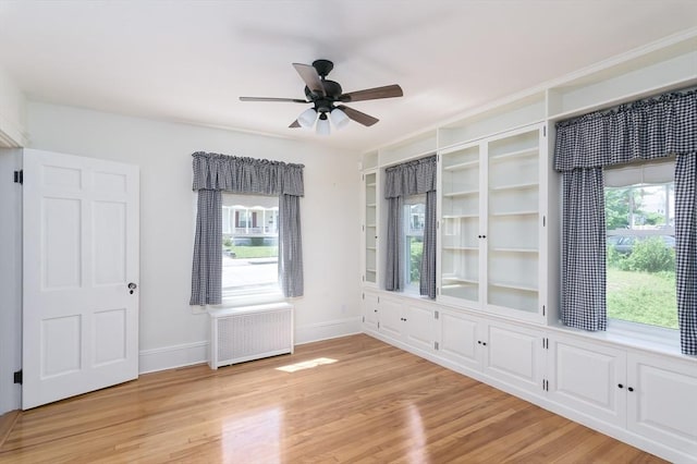20 Blaine Ave, Worcester, MA 01603 - empty room featuring radiator, a ceiling fan, and light wood-style floors