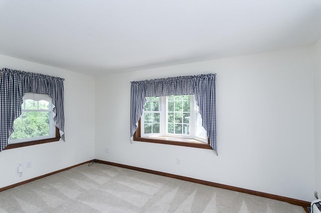 20 Blaine Ave, Worcester, MA 01603 - empty room featuring healthy amount of natural light and light carpet