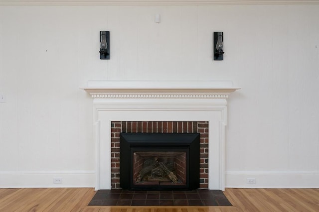 20 Blaine Ave, Worcester, MA 01603 - detailed view of a brick fireplace and wood finished floors