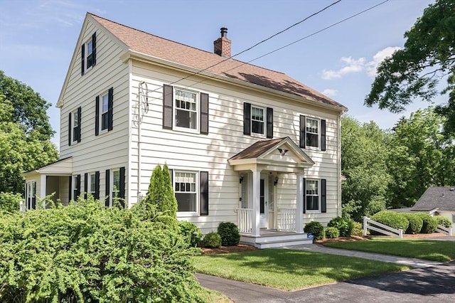 20 Blaine Ave, Worcester, MA 01603 - colonial home with a chimney, a front lawn, and roof with shingles