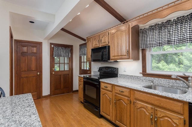 20 Blaine Ave, Worcester, MA 01603 - kitchen featuring black appliances, light wood-type flooring, and light stone counters