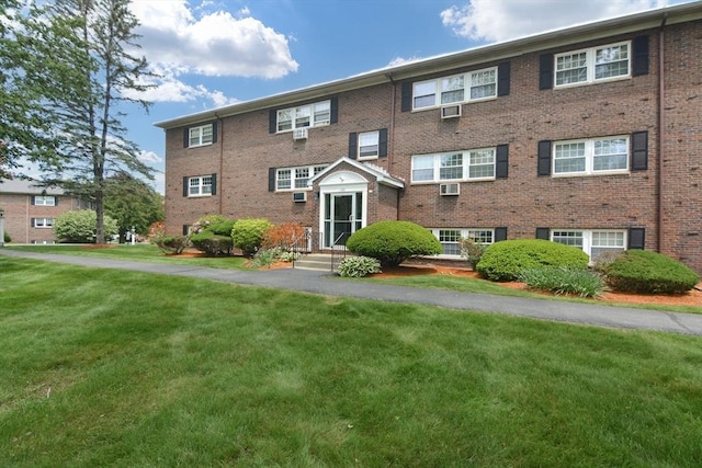 145 Milk St Unit 10, Westborough, MA 01581 - view of front of house featuring brick siding and a front yard