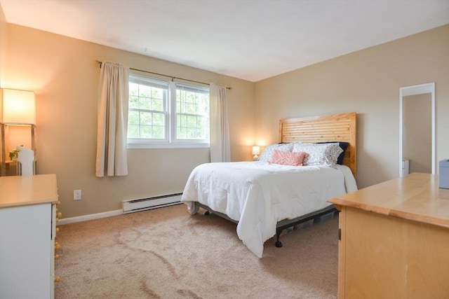 145 Milk St Unit 10, Westborough, MA 01581 - bedroom featuring a baseboard heating unit and light colored carpet