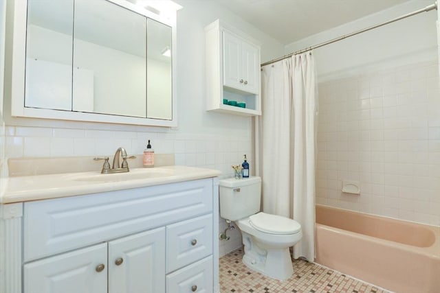 145 Milk St Unit 10, Westborough, MA 01581 - full bathroom featuring tile walls, tile patterned floors, vanity, and shower / bathtub combination with curtain