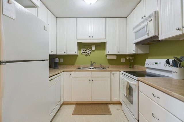 145 Milk St Unit 10, Westborough, MA 01581 - kitchen with white appliances, white cabinets, and light countertops