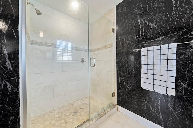 bathroom featuring a shower stall