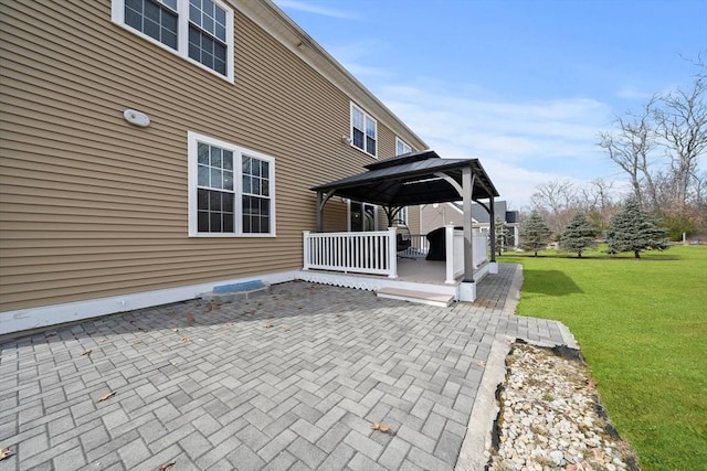 view of patio / terrace with a deck and a gazebo