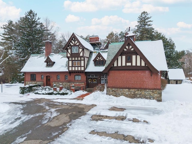 english style home with a chimney