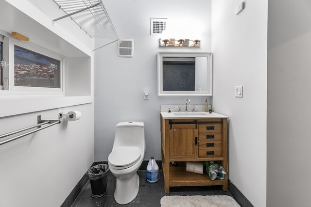 bathroom featuring vanity and toilet