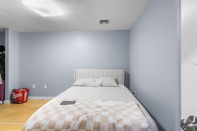 bedroom with wood-type flooring