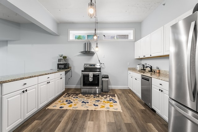 kitchen featuring white cabinetry, appliances with stainless steel finishes, hanging light fixtures, and dark wood-type flooring