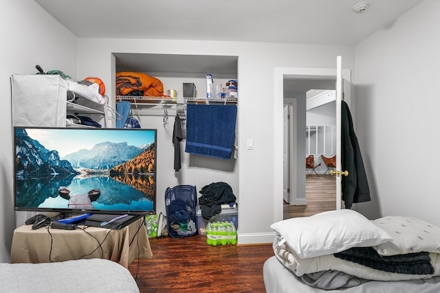 bedroom featuring dark hardwood / wood-style flooring