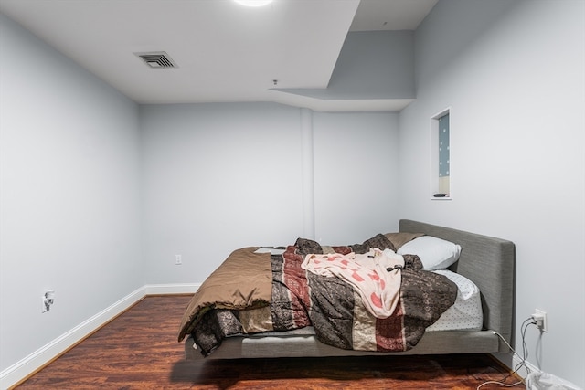 bedroom featuring dark wood-type flooring