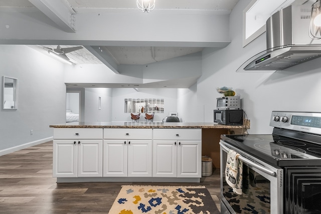 kitchen featuring white cabinets, stainless steel electric range, wall chimney range hood, and dark hardwood / wood-style flooring