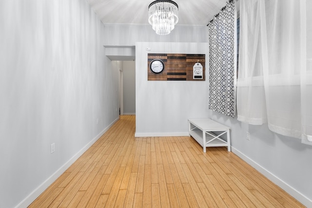 interior space featuring a notable chandelier and hardwood / wood-style flooring