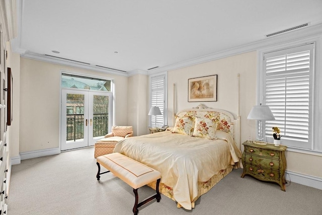 carpeted bedroom featuring ornamental molding, baseboards, and access to outside