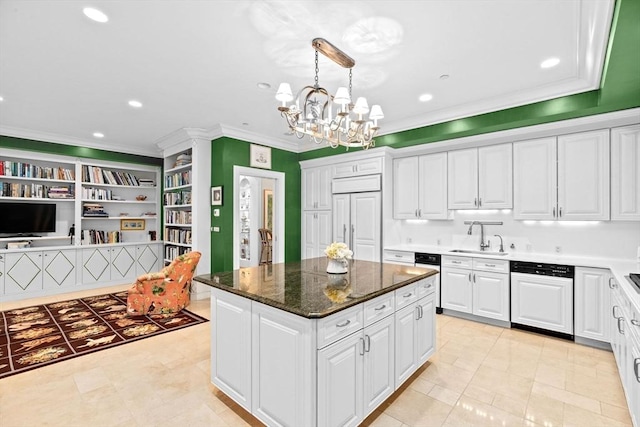 kitchen featuring a notable chandelier, white cabinetry, a sink, and paneled appliances