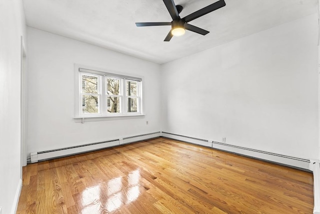 unfurnished room with a ceiling fan and wood finished floors