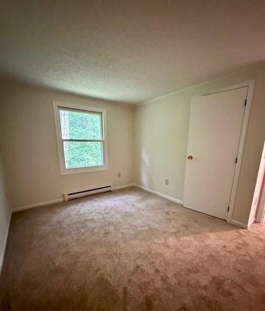 270 Sunderland St Unit 77, Worcester, MA 01604 - carpeted spare room with a baseboard heating unit and baseboards