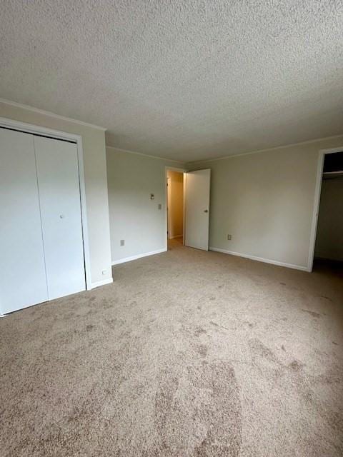 270 Sunderland St Unit 77, Worcester, MA 01604 - unfurnished bedroom with a textured ceiling, light carpet, and baseboards