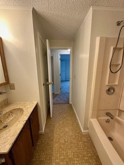 270 Sunderland St Unit 77, Worcester, MA 01604 - full bath with a textured ceiling, vanity, baseboards, shower / tub combination, and tile patterned floors
