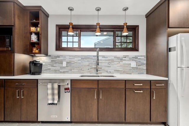 119 S Main St, Sharon, MA 02067 - kitchen with freestanding refrigerator, a sink, dishwasher, tasteful backsplash, and light countertops