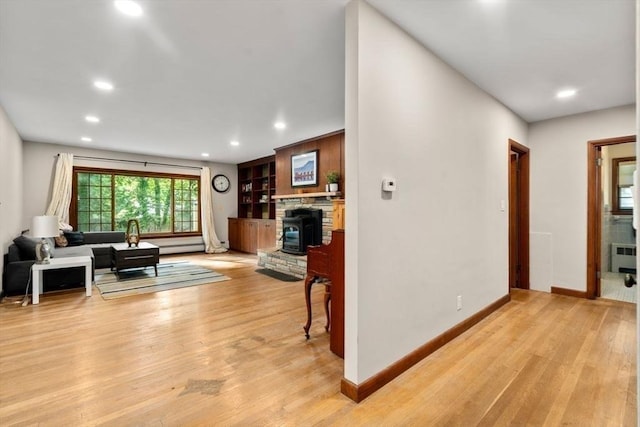119 S Main St, Sharon, MA 02067 - living room with light wood-type flooring, recessed lighting, baseboards, and radiator