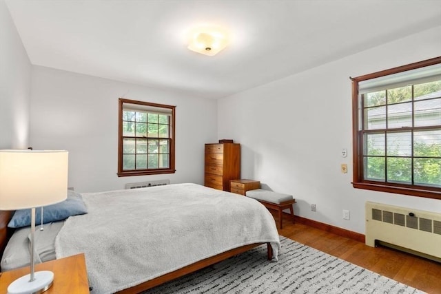 119 S Main St, Sharon, MA 02067 - bedroom with radiator, wood finished floors, and baseboards