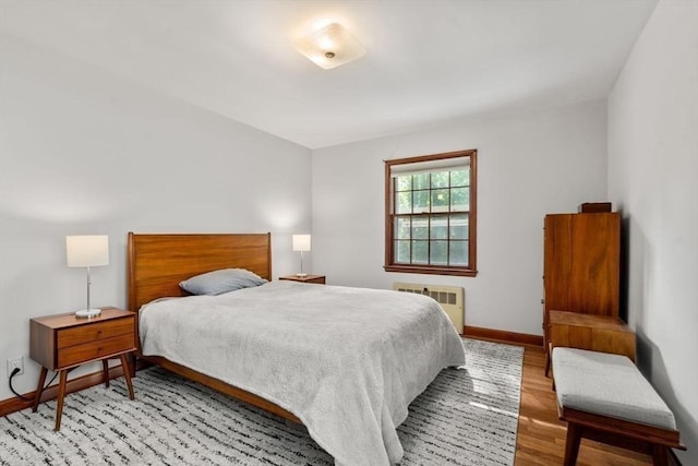 119 S Main St, Sharon, MA 02067 - bedroom with radiator, light wood-style flooring, and baseboards