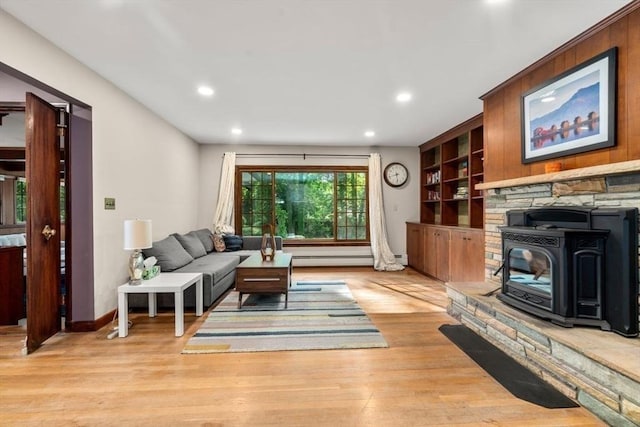 119 S Main St, Sharon, MA 02067 - living room with recessed lighting, wood finished floors, a baseboard radiator, a wood stove, and built in features