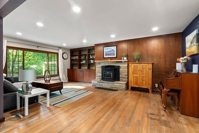 119 S Main St, Sharon, MA 02067 - living room with light wood-style flooring, wood walls, and recessed lighting
