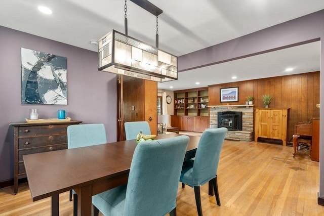 119 S Main St, Sharon, MA 02067 - dining area with light wood finished floors, recessed lighting, built in features, and a stone fireplace