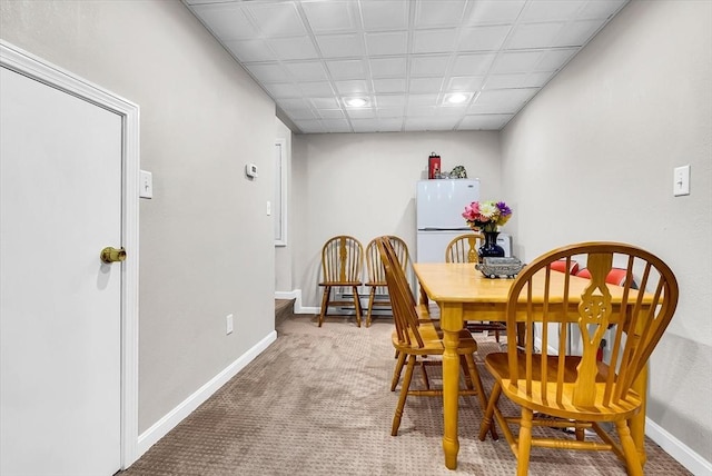 view of carpeted dining space